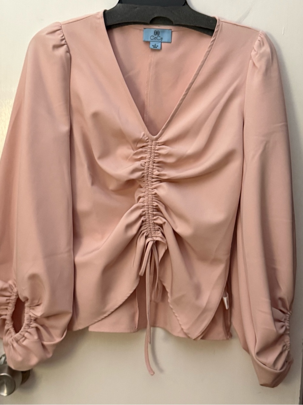 lCeCe V-neck blouse featuring ruched front & puff sleeve